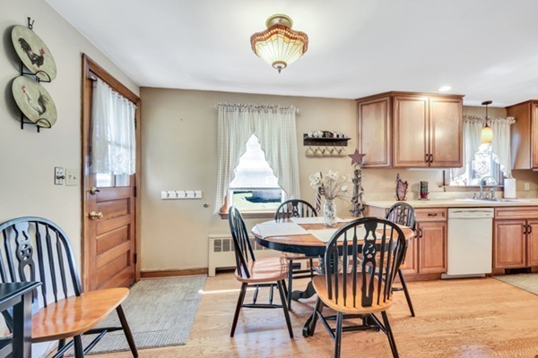 11 Melo Road Woburn, MA 01801 - Photo 5 of 22 a view of a dining room with furniture and a kitchen