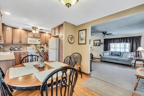 11 Melo Road Woburn, MA 01801 - Photo 7 of 22 a view of a dining room with furniture and a rug
