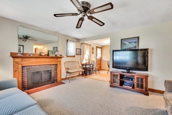 11 Melo Road Woburn, MA 01801 - Photo 9 of 22 a living room with furniture and a flat screen tv