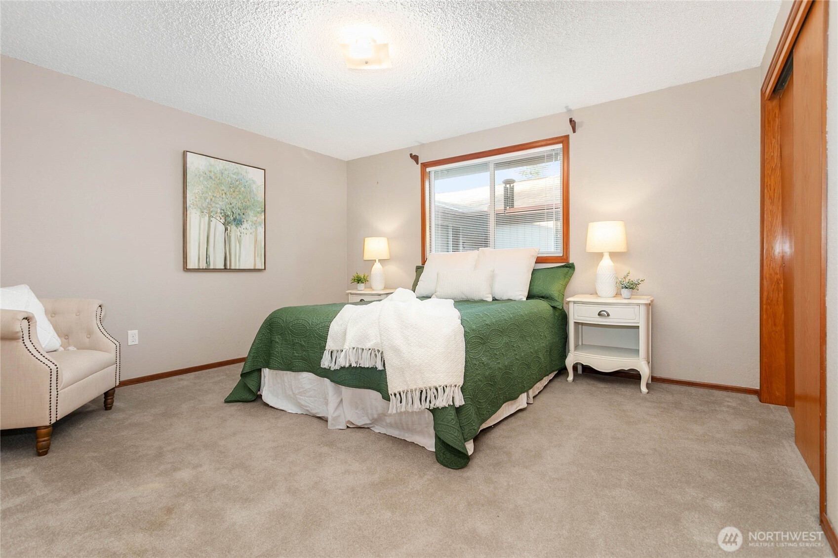 508 Forest Circle, Unit 4A Lynden, WA 98264 - Photo 17 of 25 a bedroom with a bed mirror and window