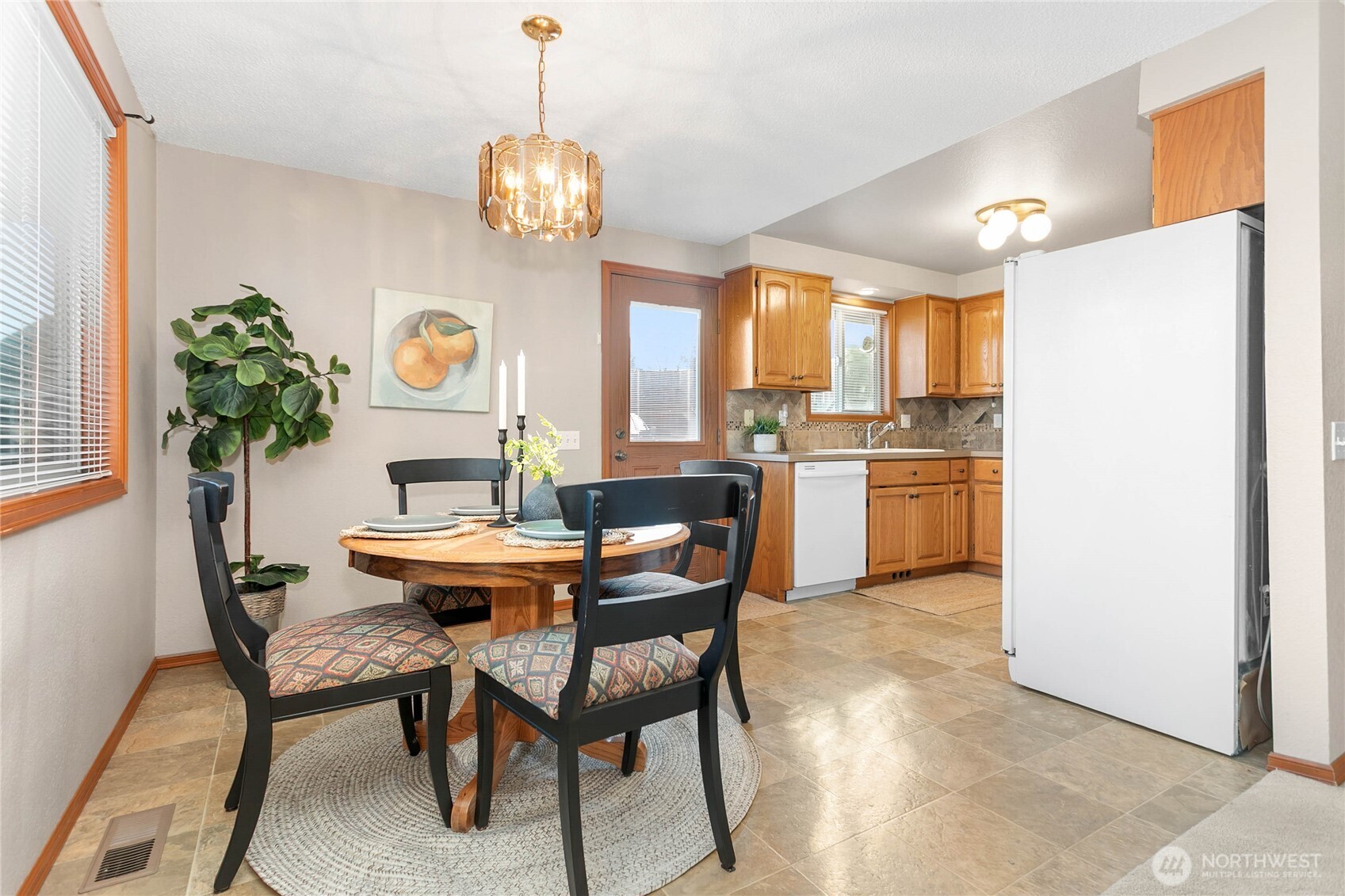 508 Forest Circle, Unit 4A Lynden, WA 98264 - Photo 10 of 25 a view of a dining room with furniture and a chandelier