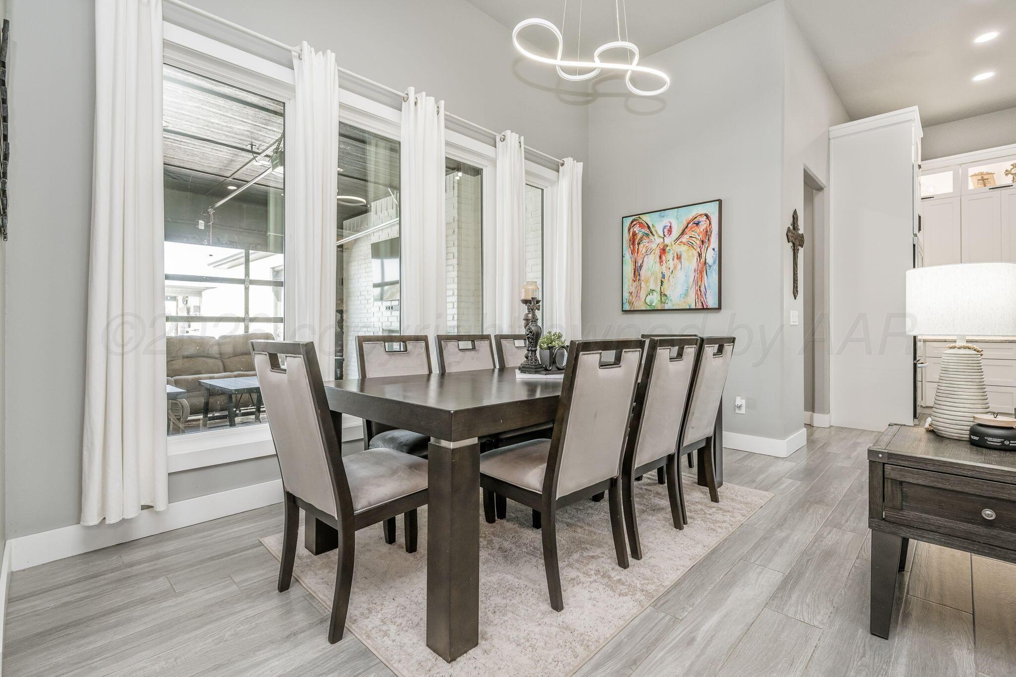17400 Spring Lake Drive Canyon, TX 79015 - Photo 12 of 52 a view of a dining room with furniture and wooden floor