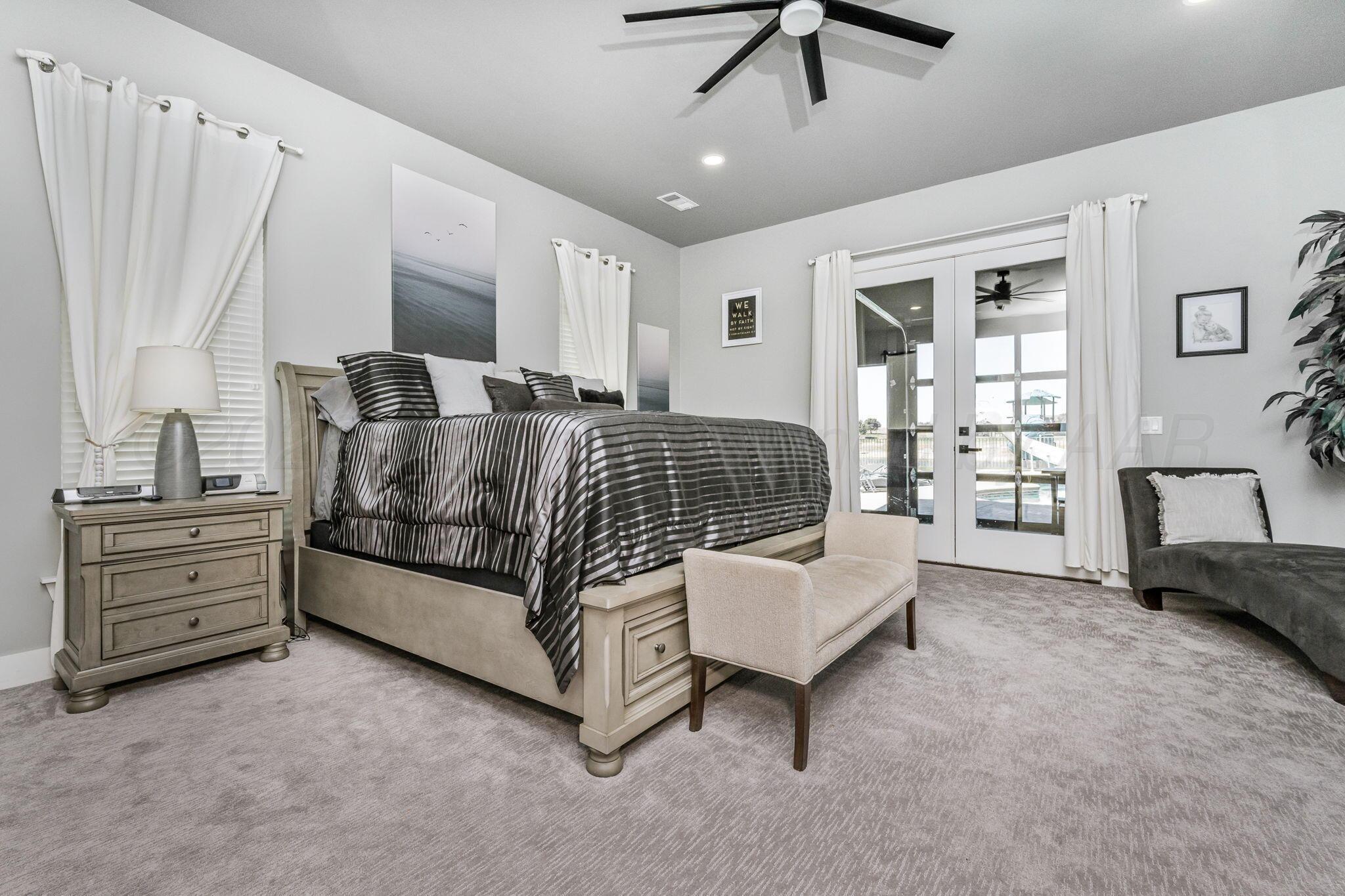 17400 Spring Lake Drive Canyon, TX 79015 - Photo 13 of 52 a bedroom with a bed couch and window