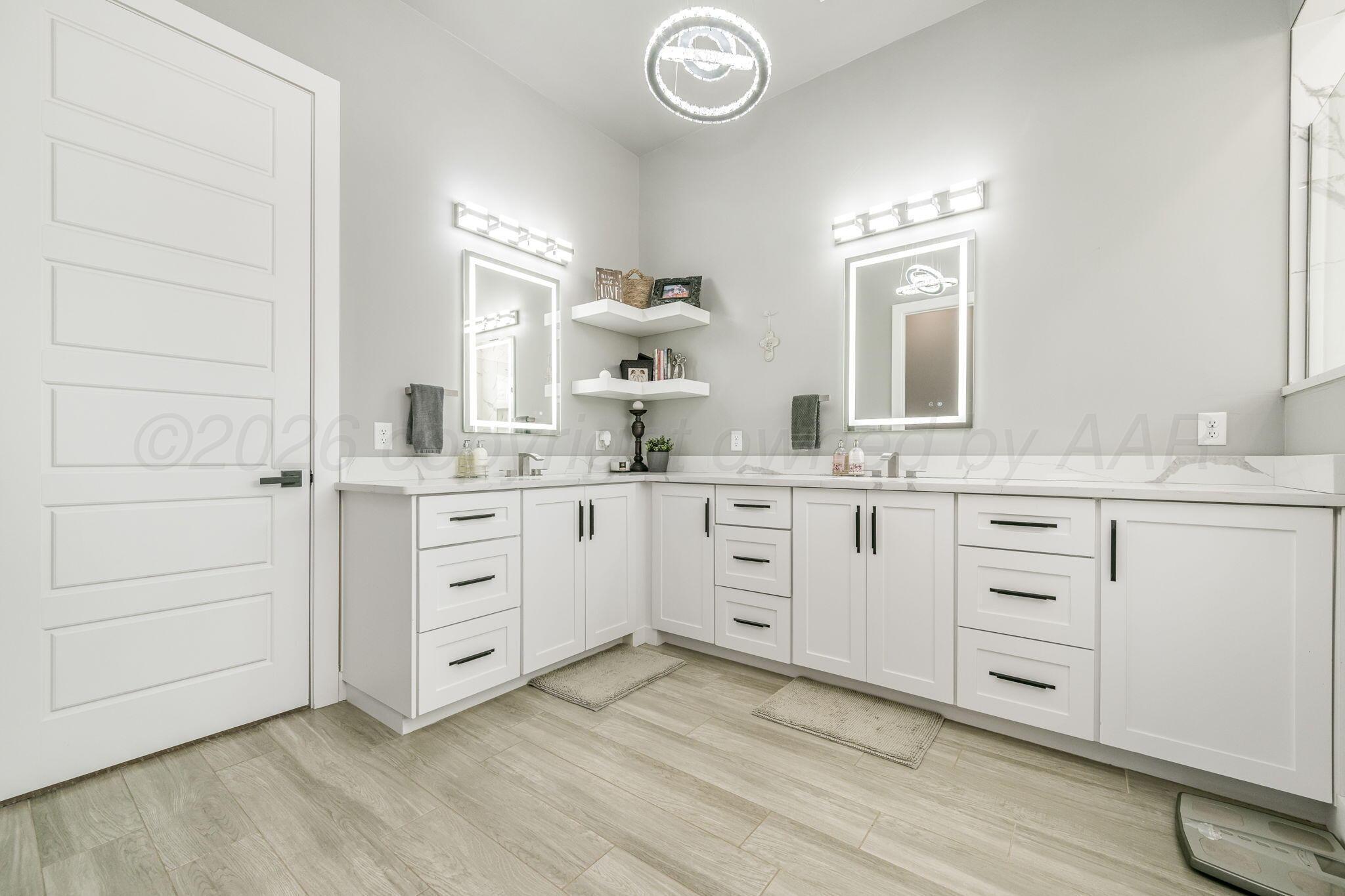 17400 Spring Lake Drive Canyon, TX 79015 - Photo 15 of 52 a spacious bathroom with a granite countertop sink mirror and