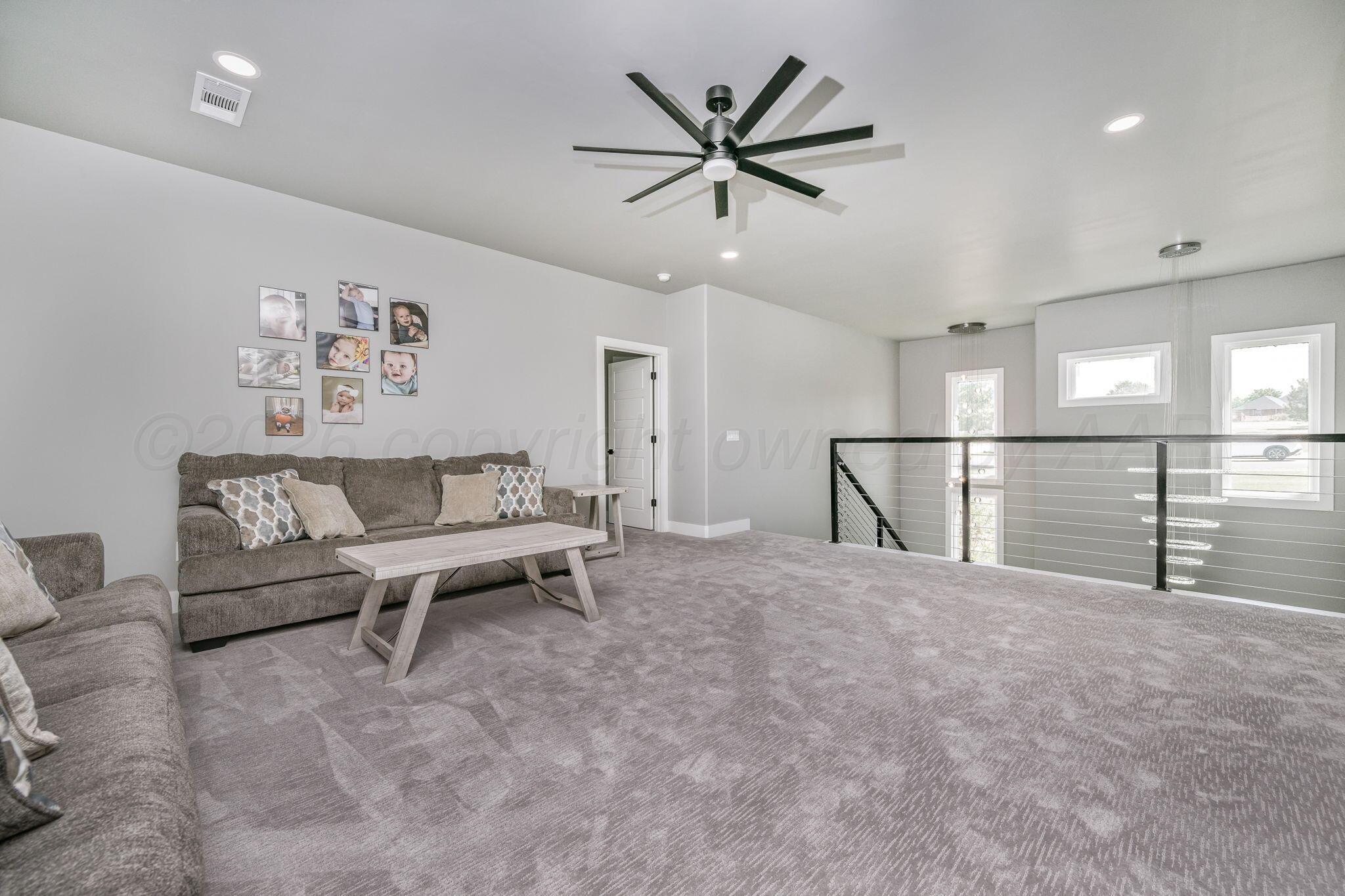 17400 Spring Lake Drive Canyon, TX 79015 - Photo 20 of 52 a view of a livingroom with furniture and a ceiling fan