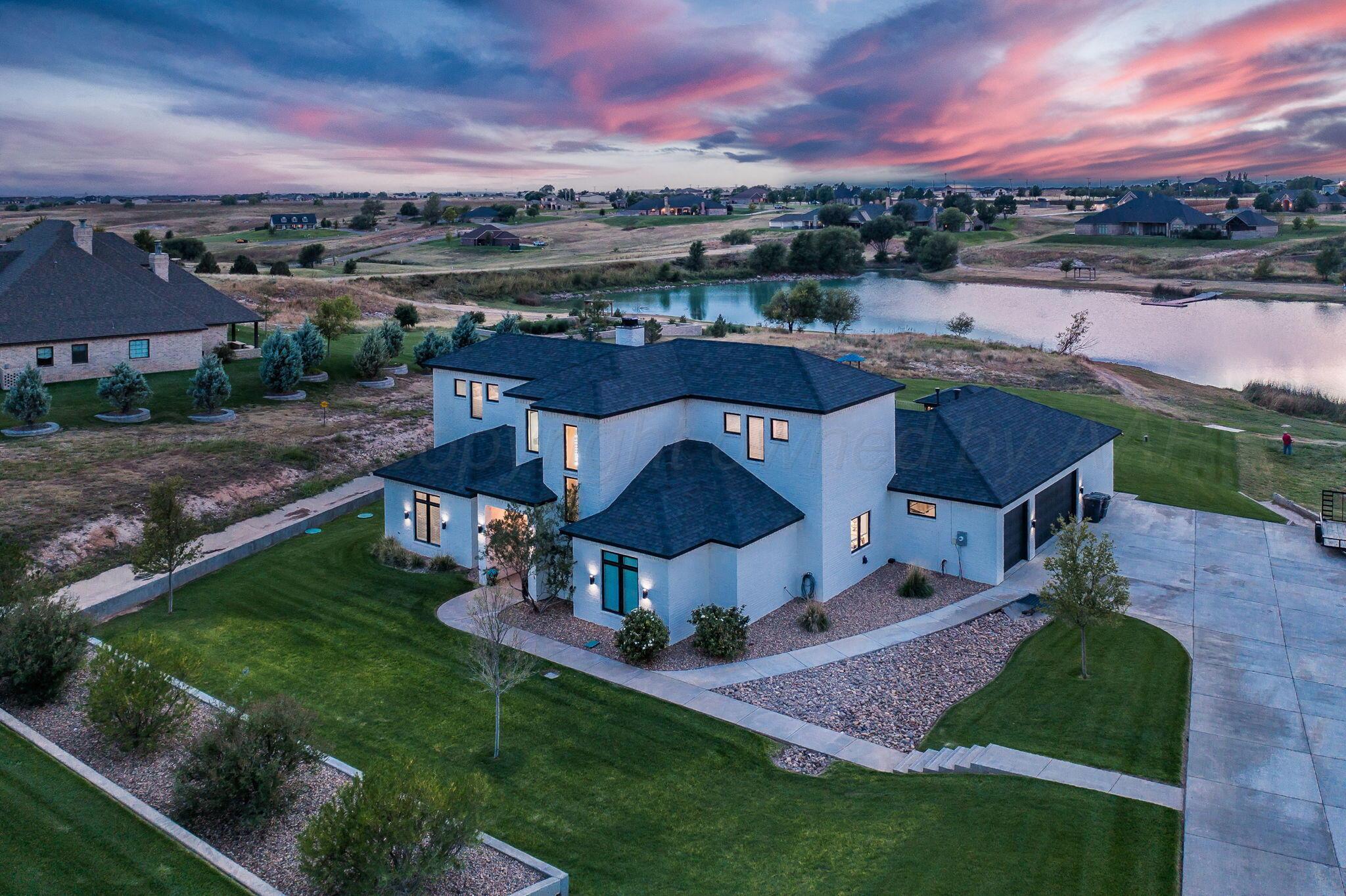 17400 Spring Lake Drive Canyon, TX 79015 - Photo 2 of 52 an aerial view of a house with a garden and a yard