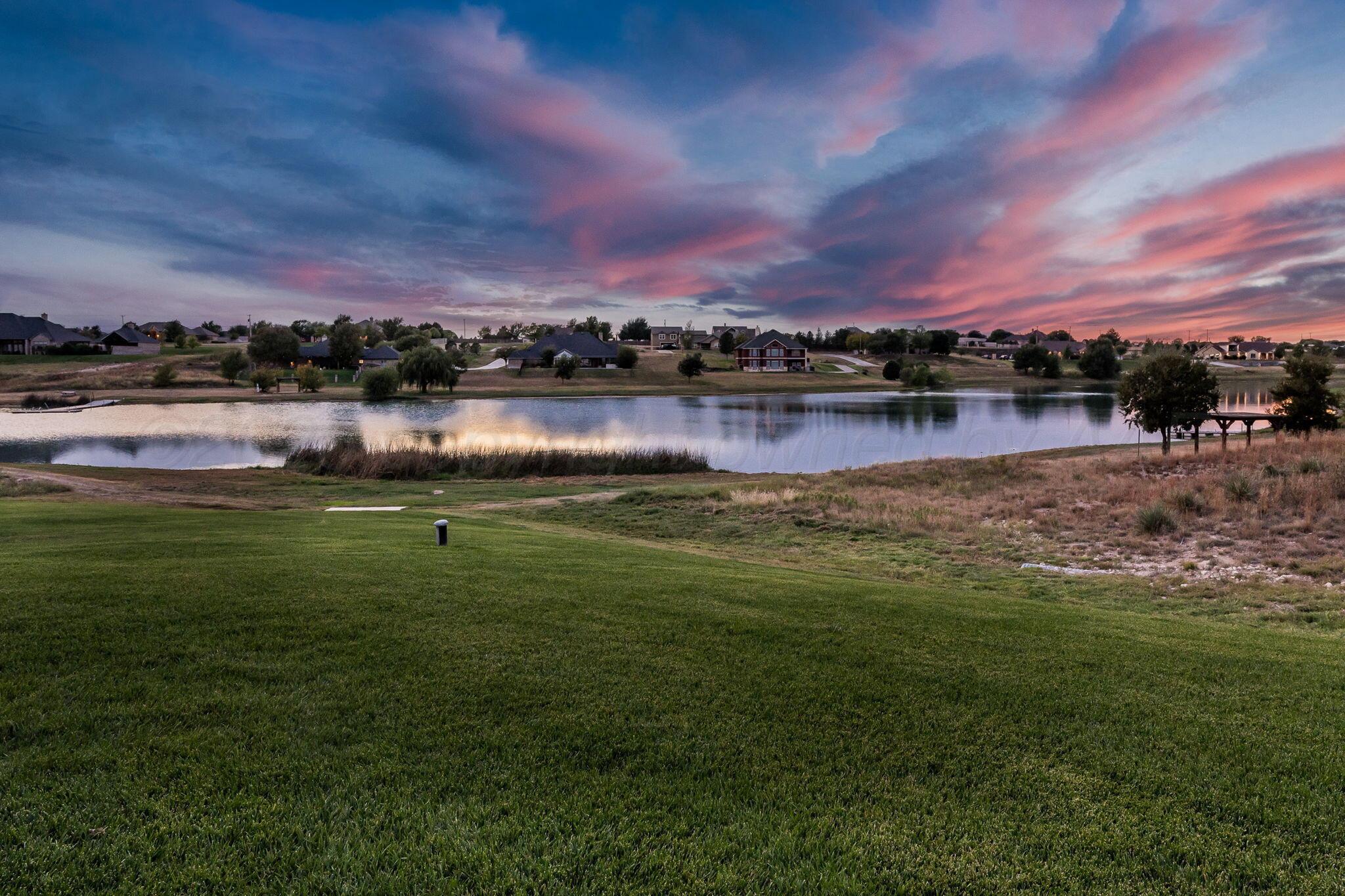 17400 Spring Lake Drive Canyon, TX 79015 - Photo 41 of 52 a view of a lake with houses in the back