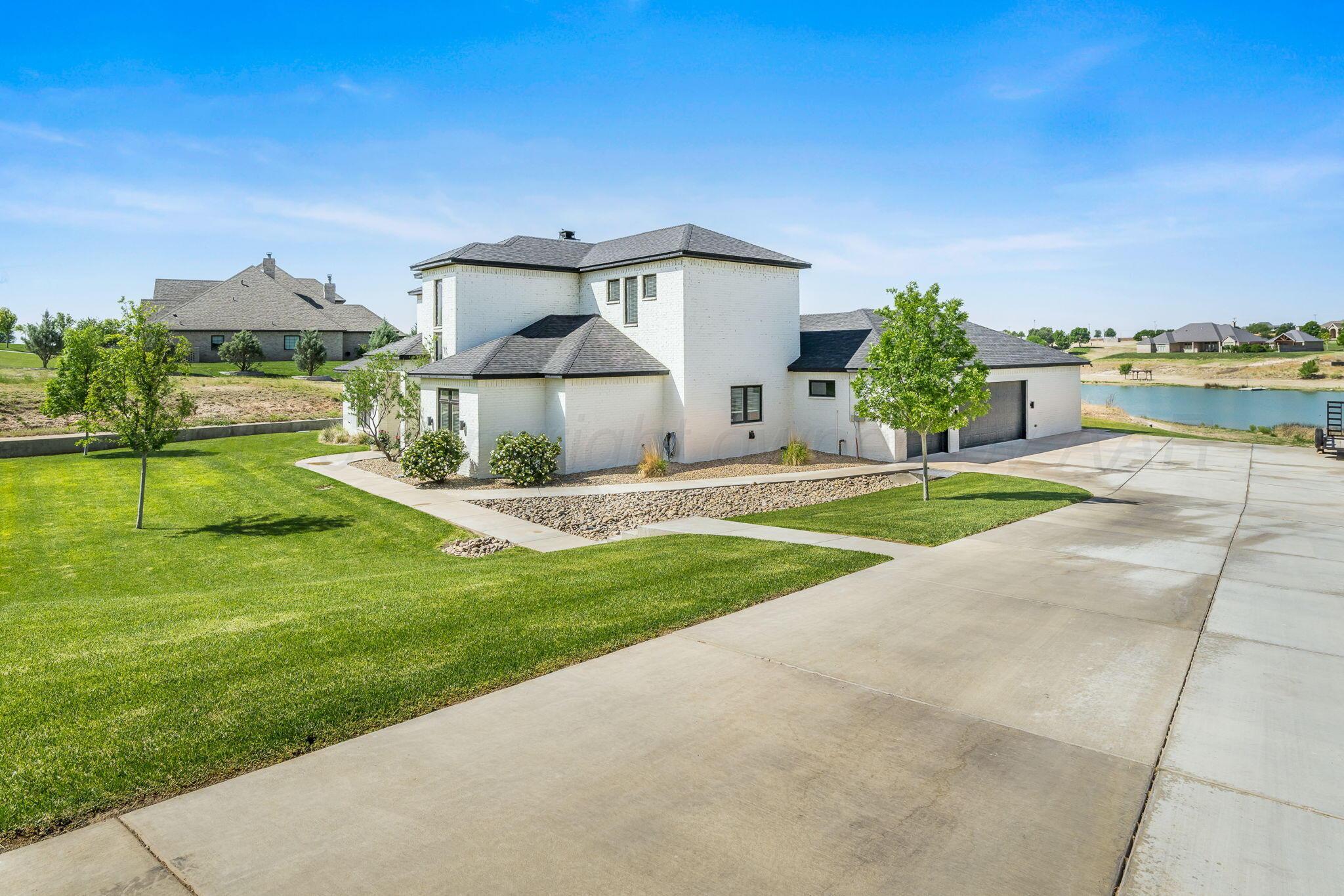 17400 Spring Lake Drive Canyon, TX 79015 - Photo 46 of 52 a view of a house with a yard and a garden