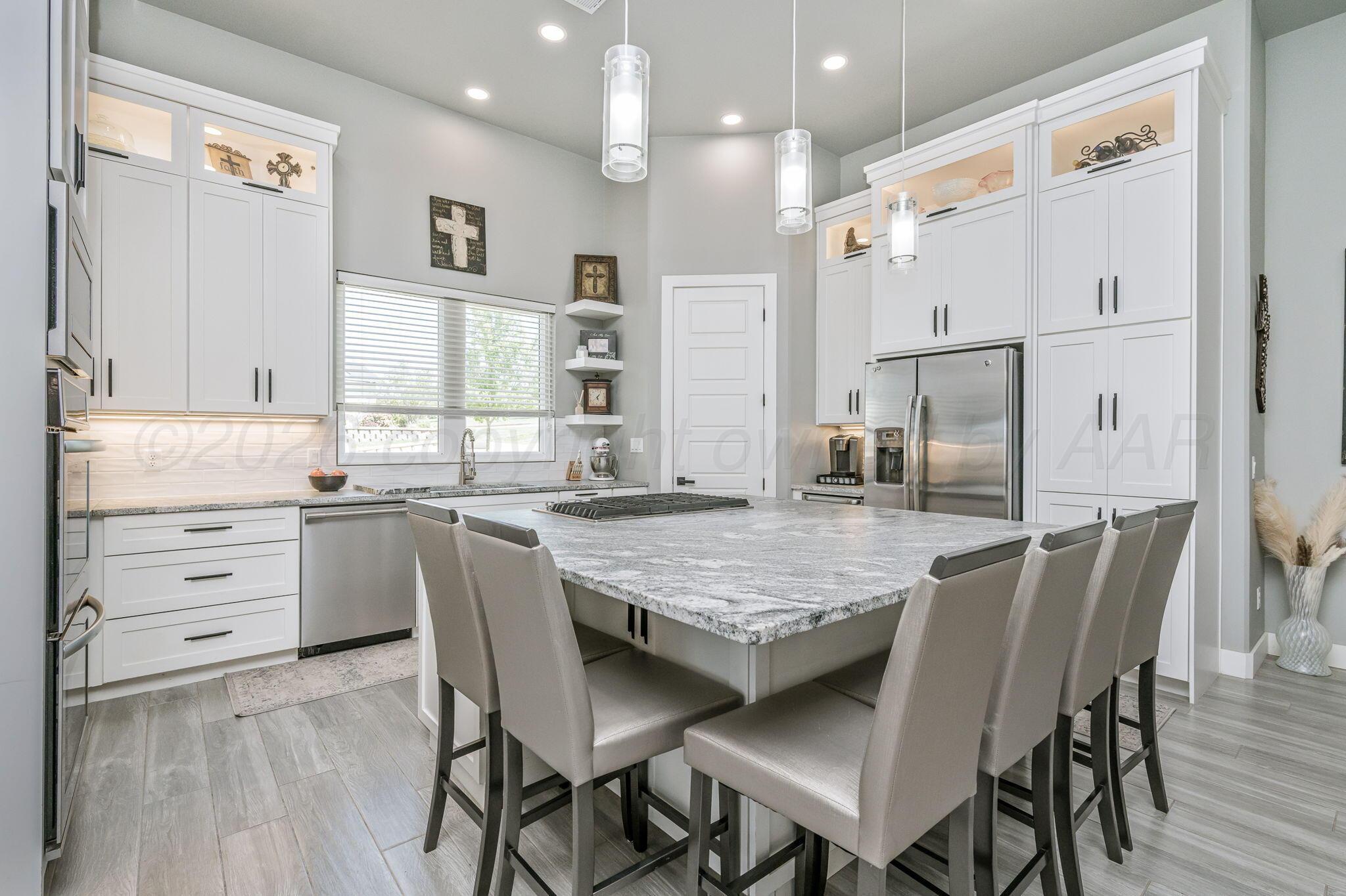 17400 Spring Lake Drive Canyon, TX 79015 - Photo 8 of 52 a dining table with chairs and wooden floor
