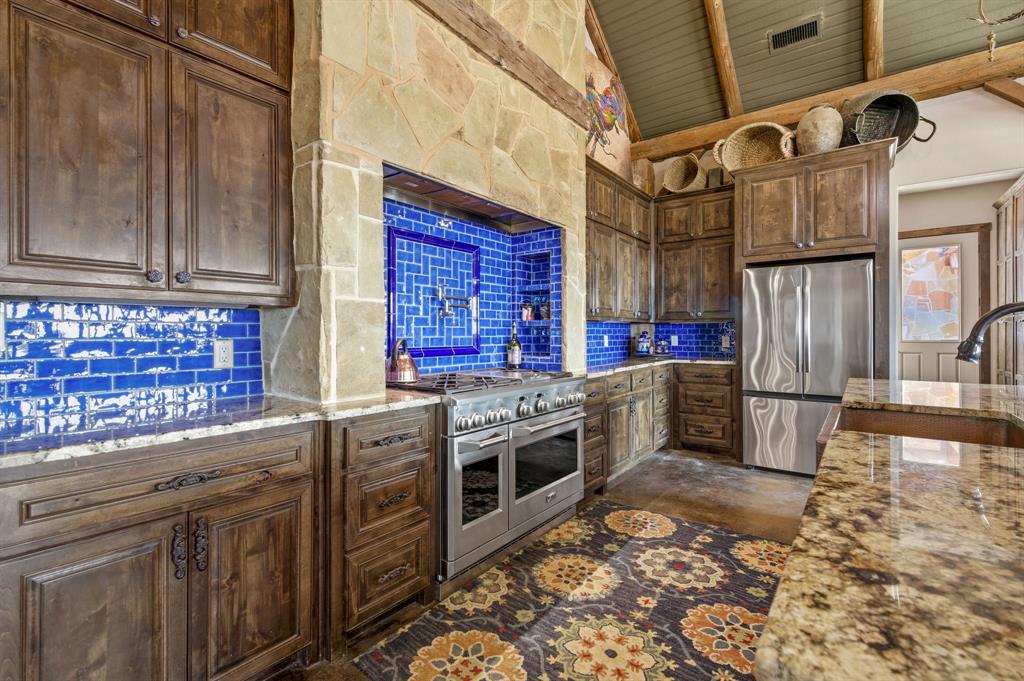 650 Fm 2035 Merkel, TX 79536 - Photo 12 of 39 a kitchen with stainless steel appliances granite countertop a stove a sink and a microwave