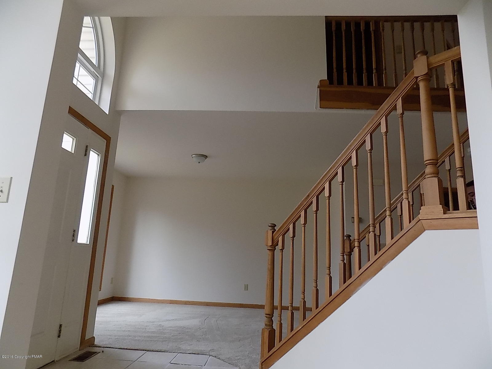 266 Oneida Way Milford, PA 18337 - Photo 13 of 22 a view of staircase with lots of frames on wall and stairs