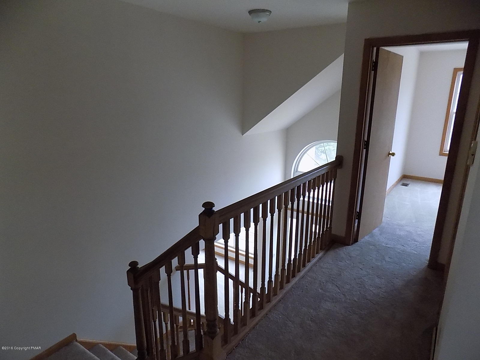 266 Oneida Way Milford, PA 18337 - Photo 19 of 22 a view of staircase with railing and white walls
