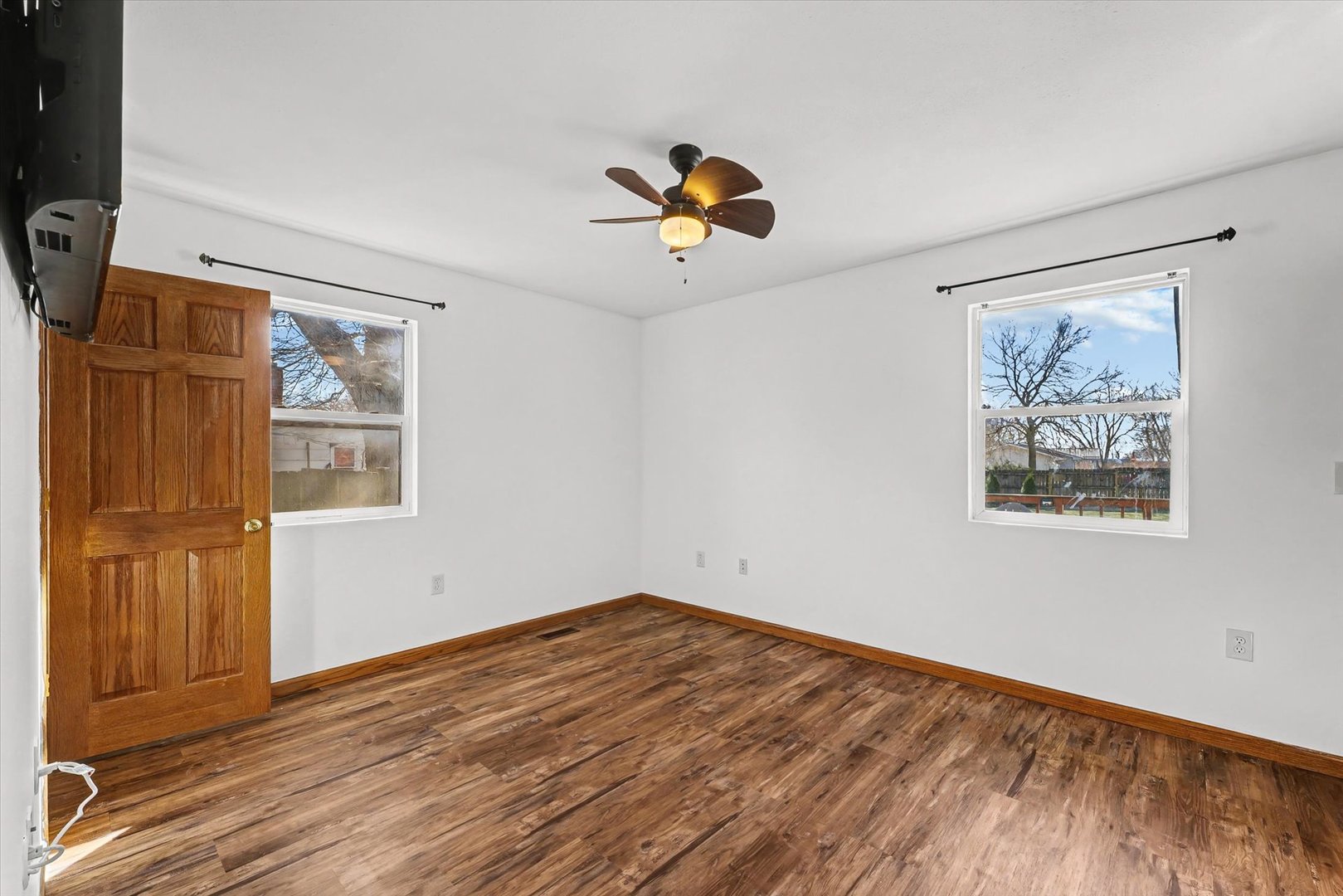 306 B W Lytle Street Newman, IL 61942 - Photo 14 of 47 a view of empty room with wooden floor and window