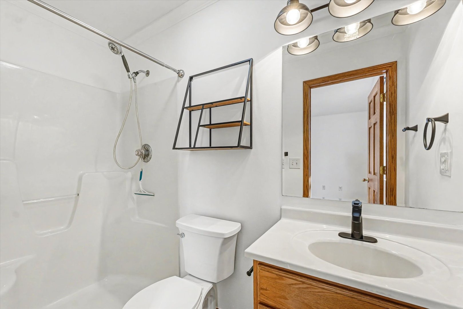 306 B W Lytle Street Newman, IL 61942 - Photo 16 of 47 a bathroom with a sink toilet and shower