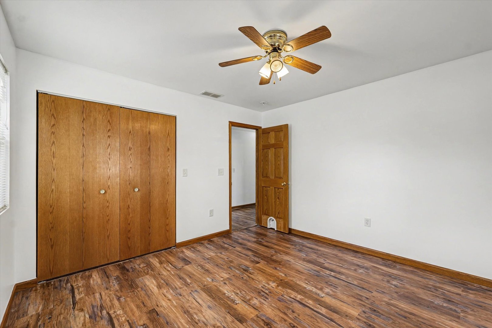 306 B W Lytle Street Newman, IL 61942 - Photo 18 of 47 a view of empty room with wooden floor