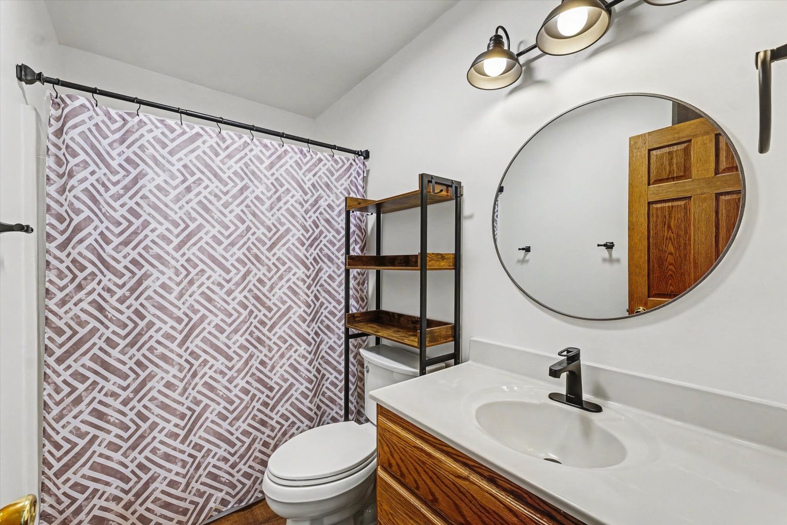 306 B W Lytle Street Newman, IL 61942 - Photo 21 of 47 a bathroom with a sink toilet and mirror
