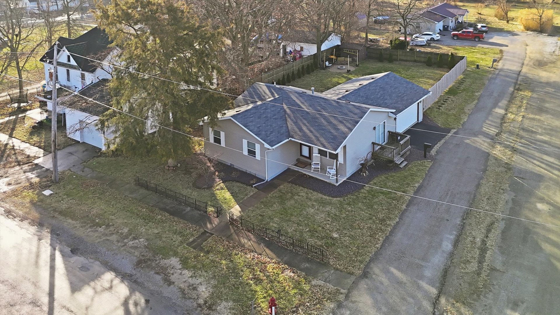 306 B W Lytle Street Newman, IL 61942 - Photo 3 of 47 an aerial view of a house with a yard and lake view