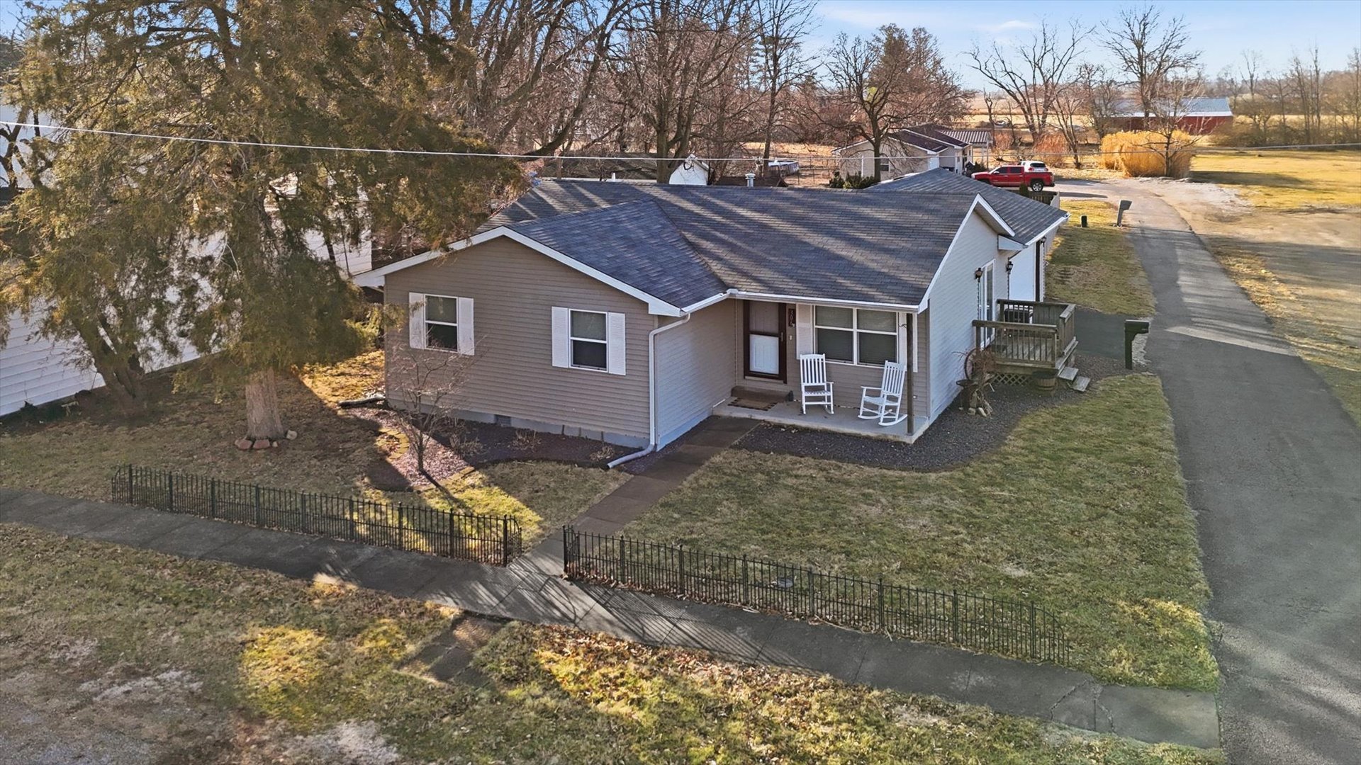 306 B W Lytle Street Newman, IL 61942 - Photo 44 of 47 a view of a house with a wooden fence