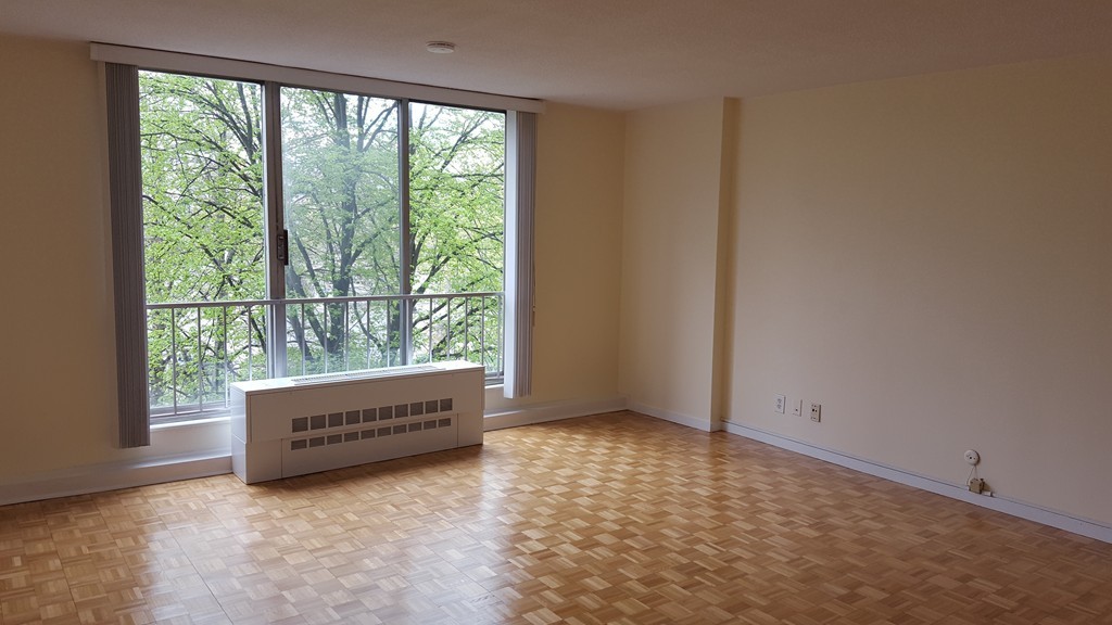 a view of an empty room with a window