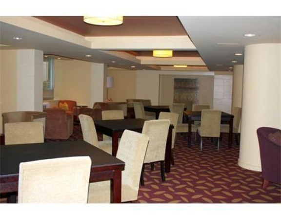 44 Washington Street, Unit 411 Brookline, MA 02445 - Photo 17 of 23 a view of a dining room with furniture