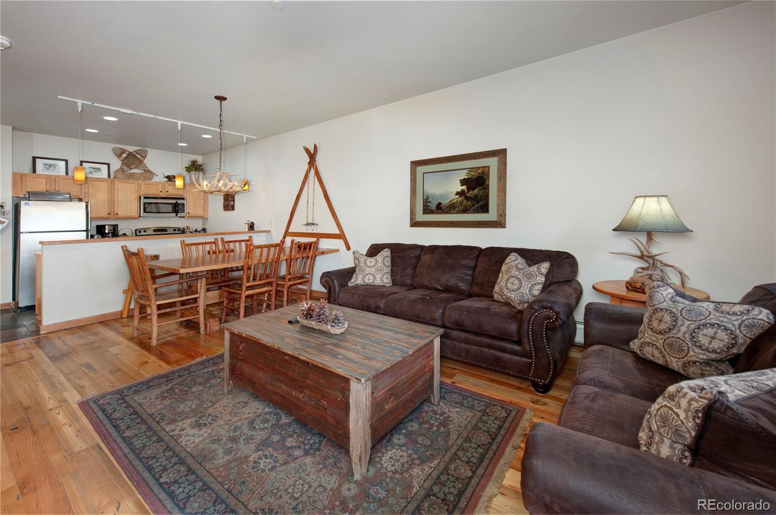 91 River Run Road, Unit 8122 Dillon, CO 80435 - Photo 3 of 33 a living room with furniture and a wooden floor