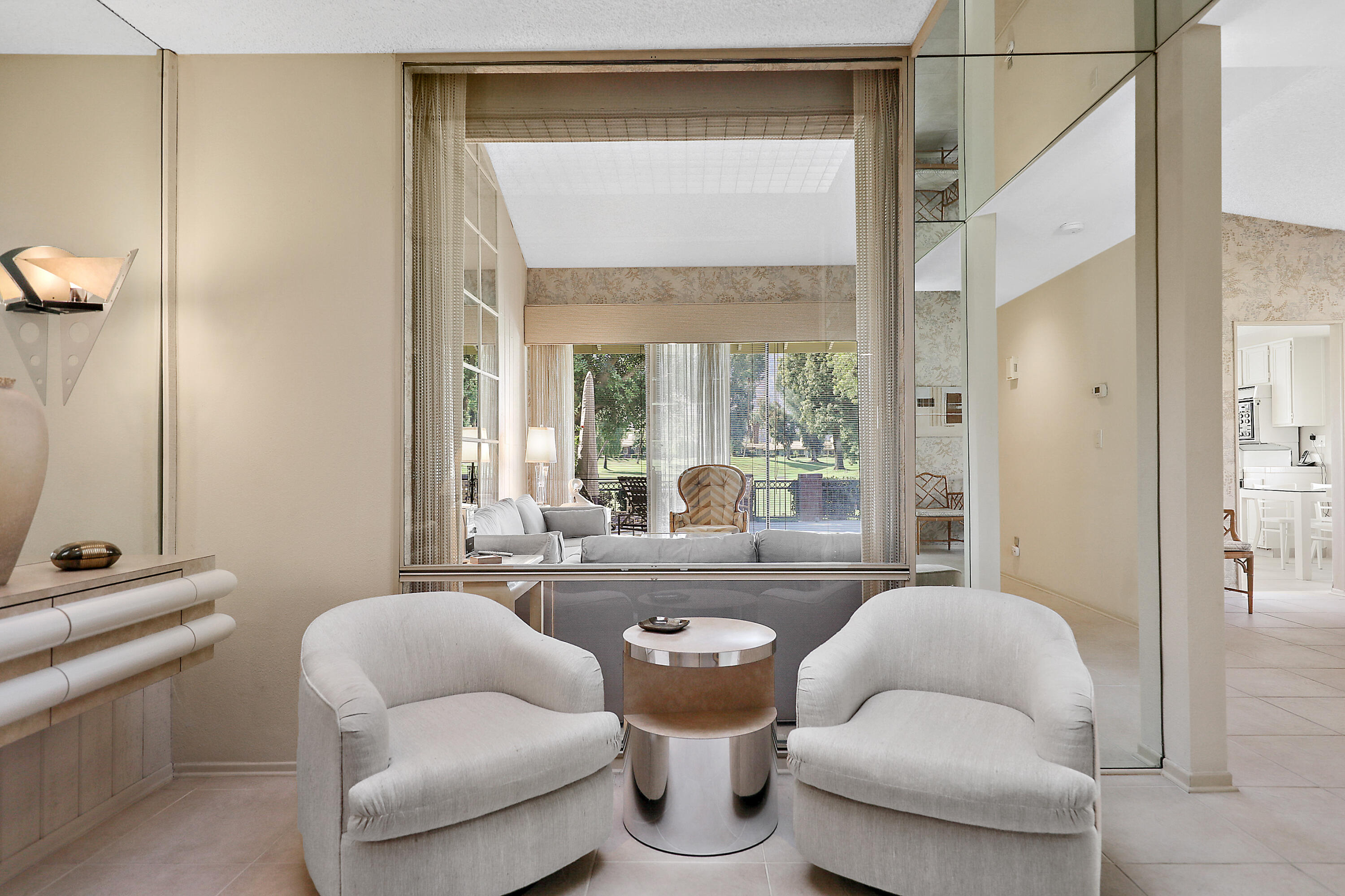 175 Gran Via Palm Desert, CA 92260 - Photo 15 of 36 a living room with furniture and a window