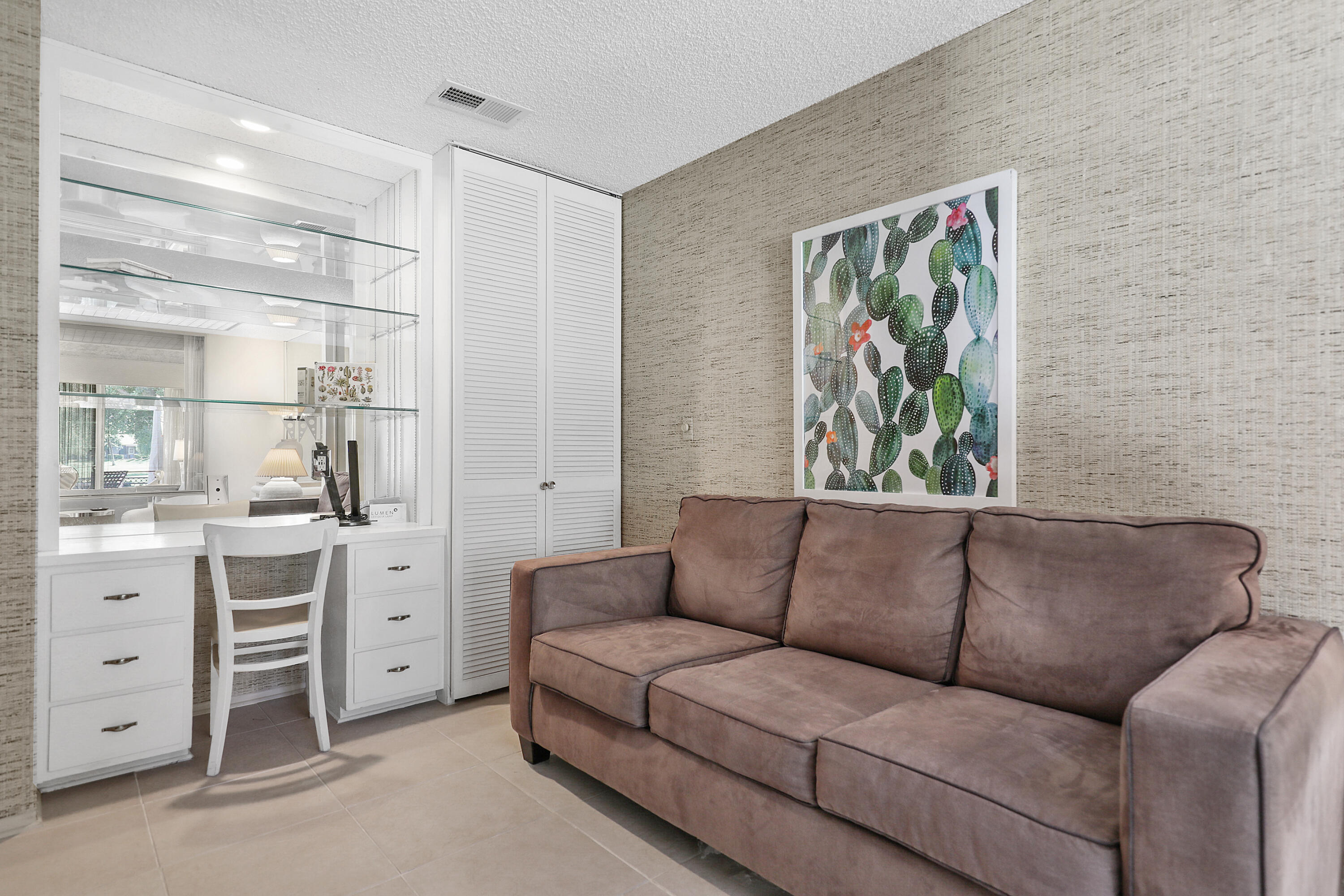 175 Gran Via Palm Desert, CA 92260 - Photo 16 of 36 a living room with furniture and a window
