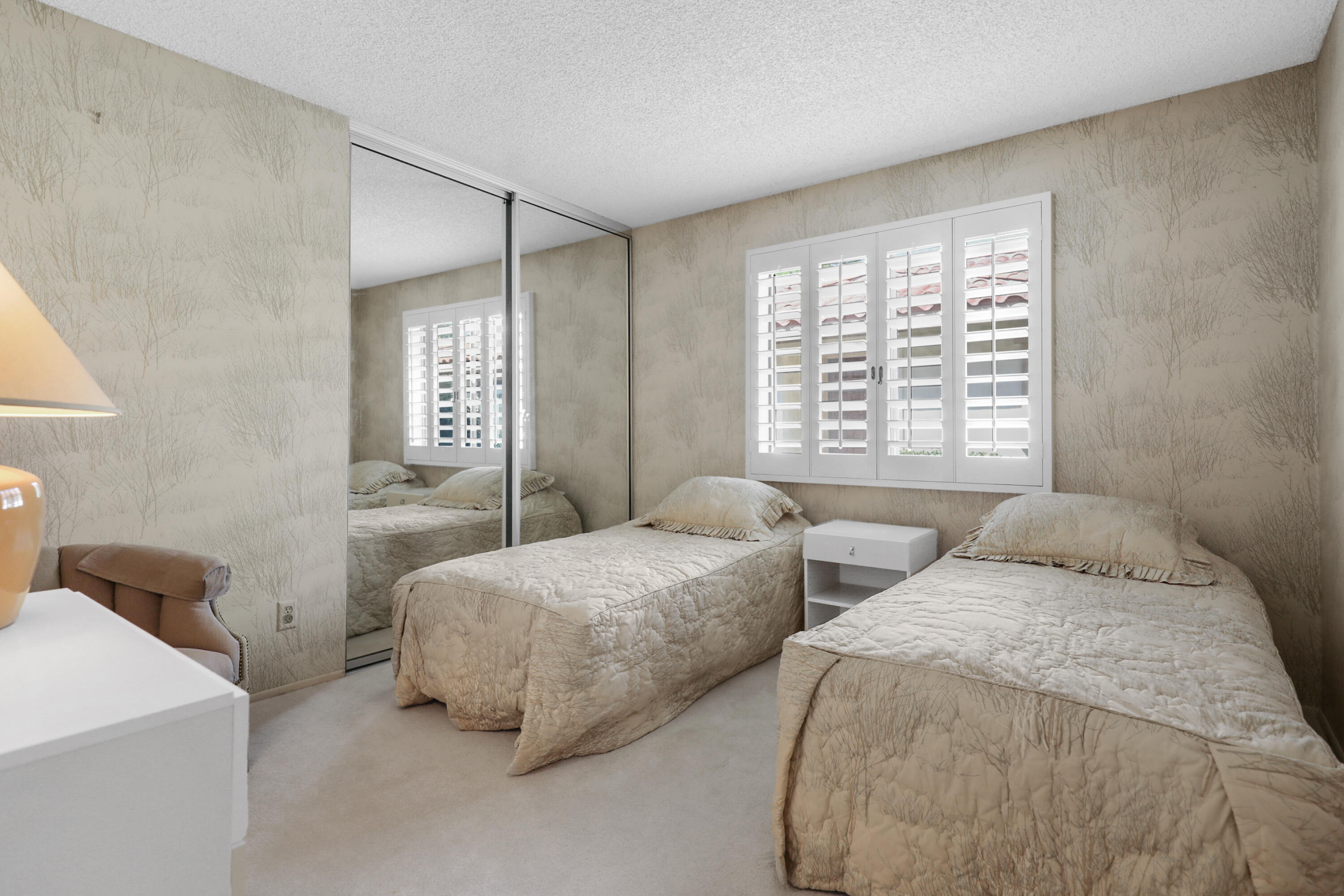 175 Gran Via Palm Desert, CA 92260 - Photo 18 of 36 a bedroom with two beds and a window