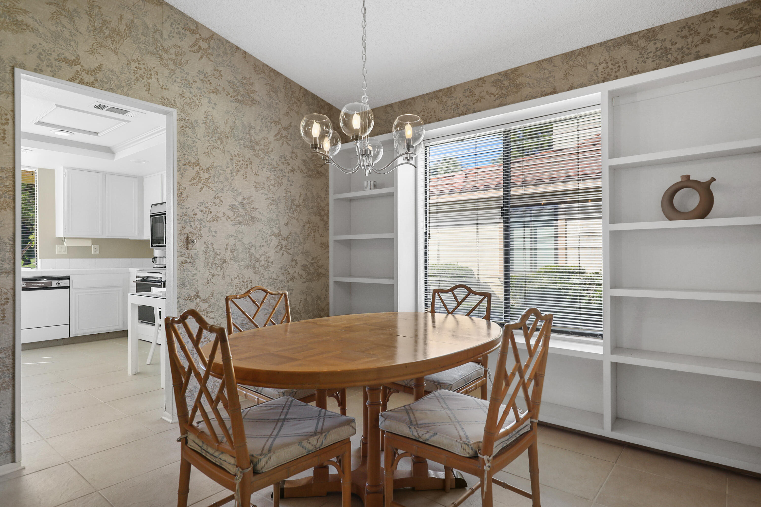 175 Gran Via Palm Desert, CA 92260 - Photo 24 of 36 a view of a dining room with furniture and window