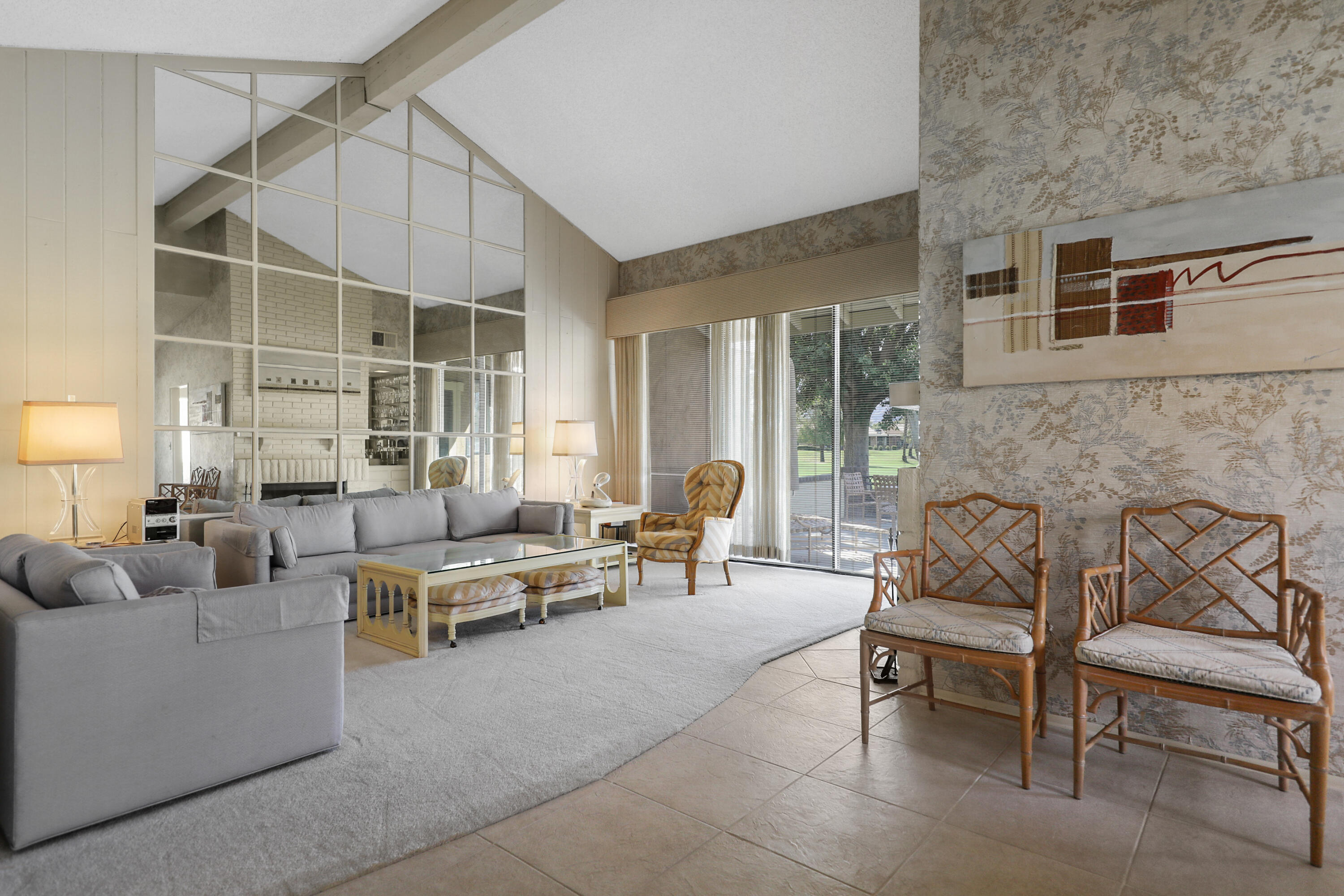 175 Gran Via Palm Desert, CA 92260 - Photo 25 of 36 a living room with furniture and a fireplace