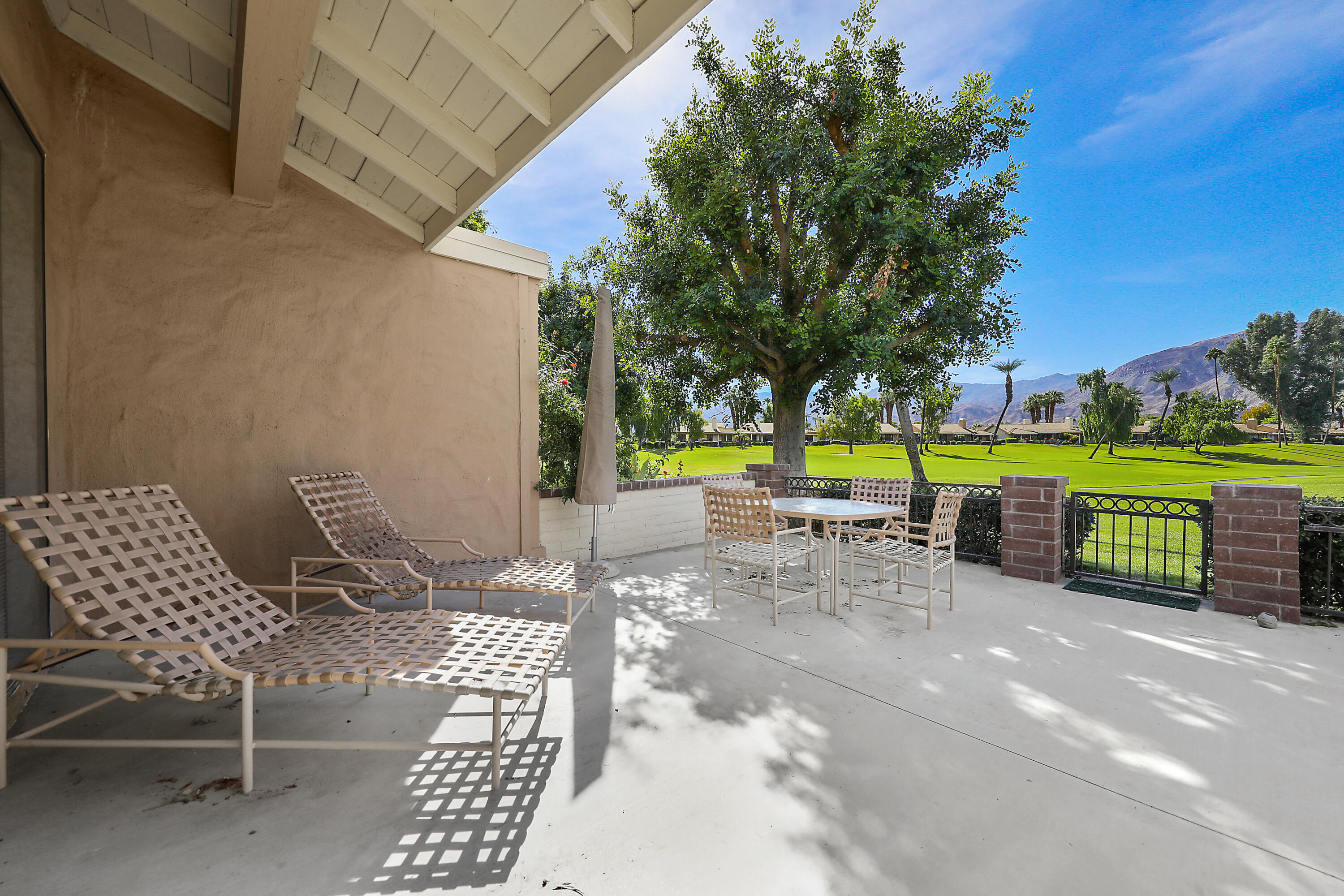 175 Gran Via Palm Desert, CA 92260 - Photo 26 of 36 a view of a yard with patio