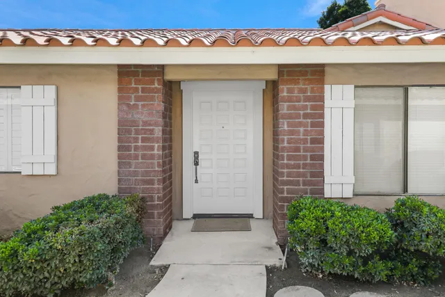 front view of a brick house with a window
