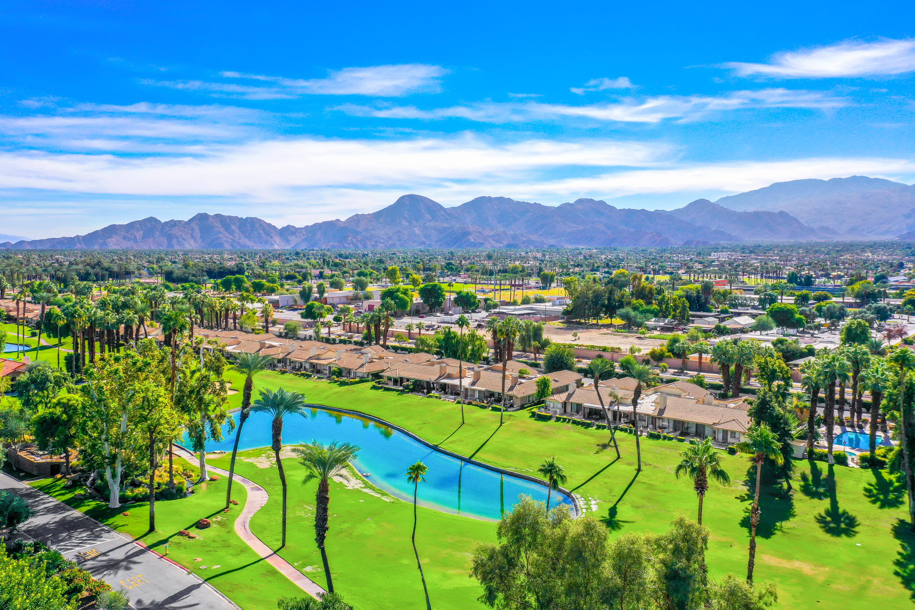 175 Gran Via Palm Desert, CA 92260 - Photo 33 of 36 a view of a city with mountains in the background