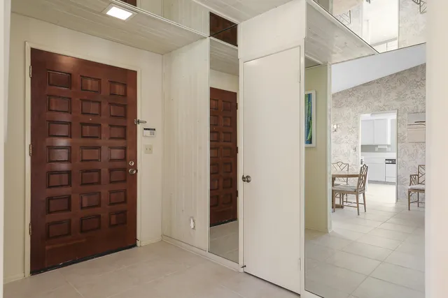 a view of a hallway with seating area