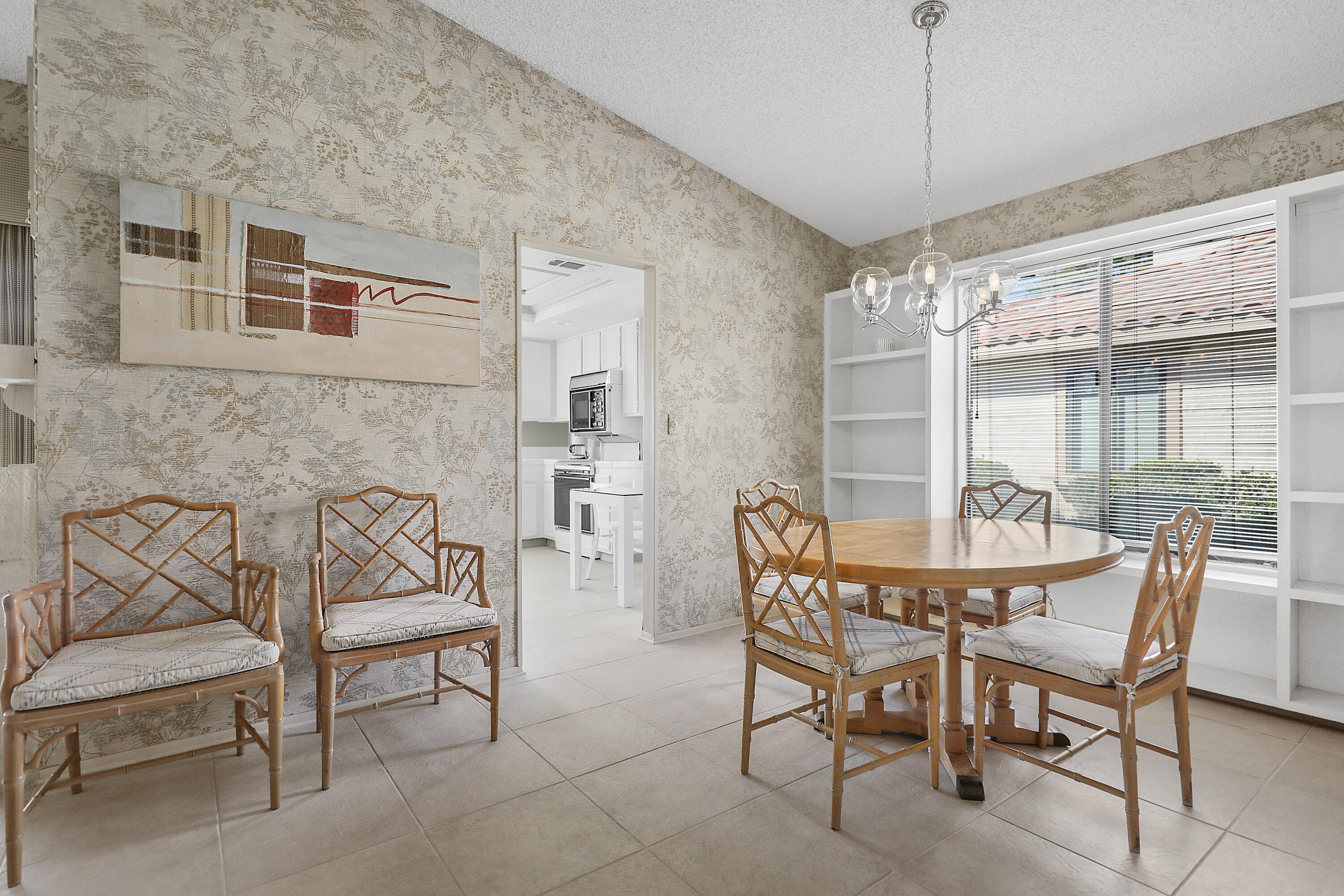175 Gran Via Palm Desert, CA 92260 - Photo 9 of 36 a dining room with furniture and window