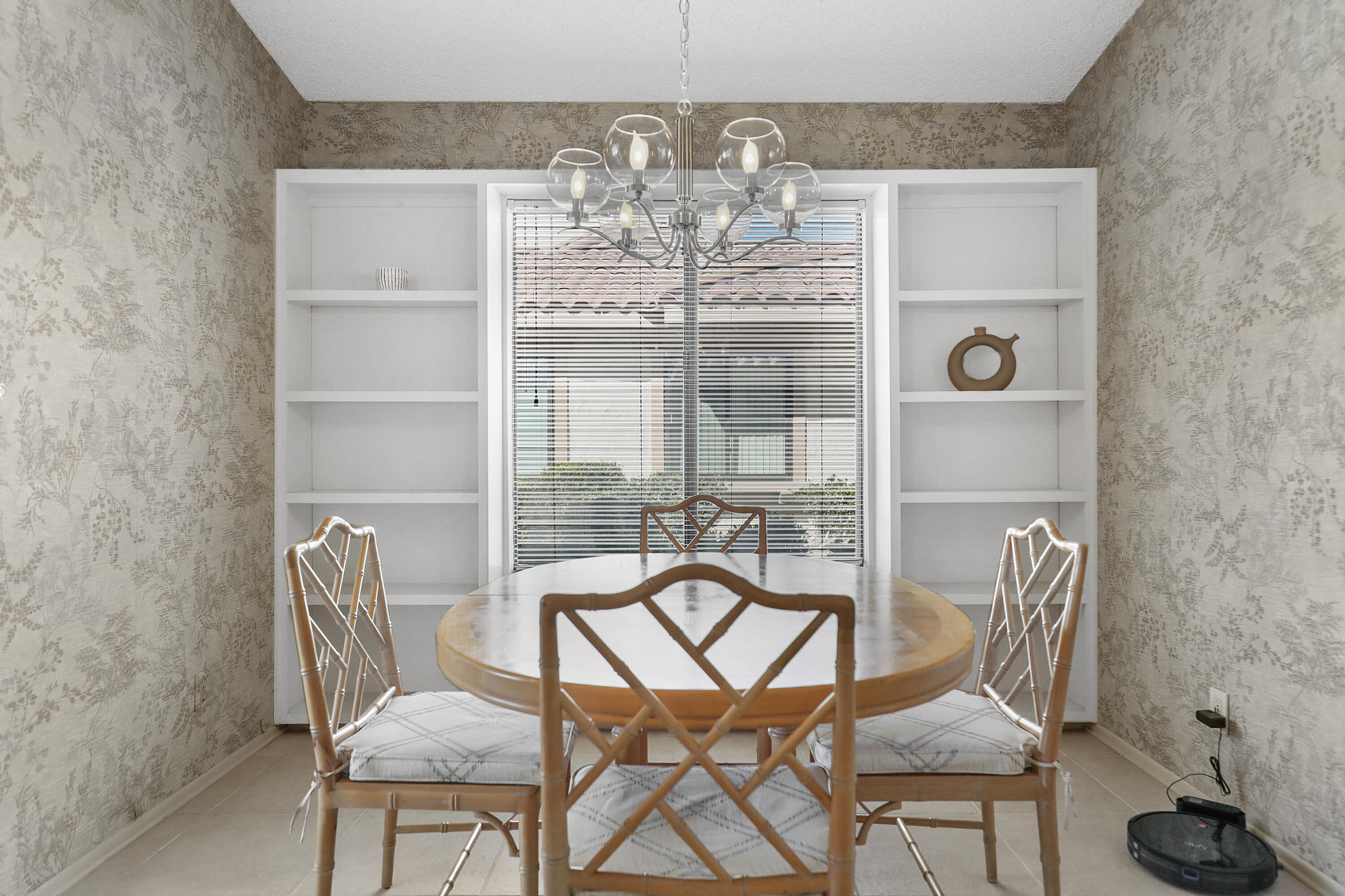 175 Gran Via Palm Desert, CA 92260 - Photo 10 of 36 a view of a dining room with furniture and chandelier