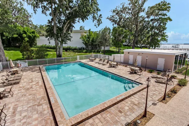 a view of a chairs and tables on the roof deck