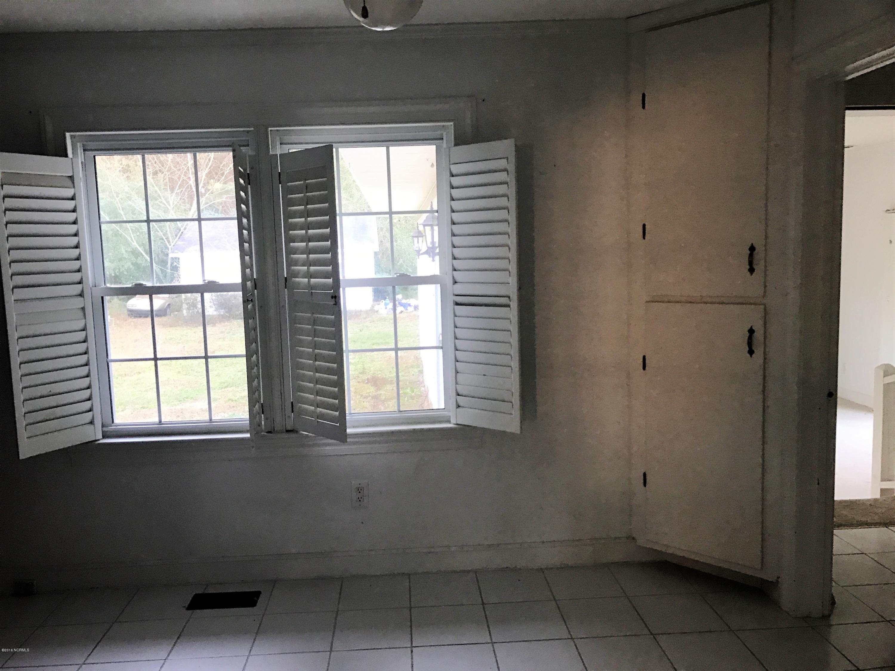 1752 Holly Ridge Road Kinston, NC 28504 - Photo 5 of 10 kitchen eating area with corner cabinet