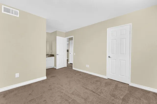 a bathroom with a granite countertop sink toilet a mirror and shower