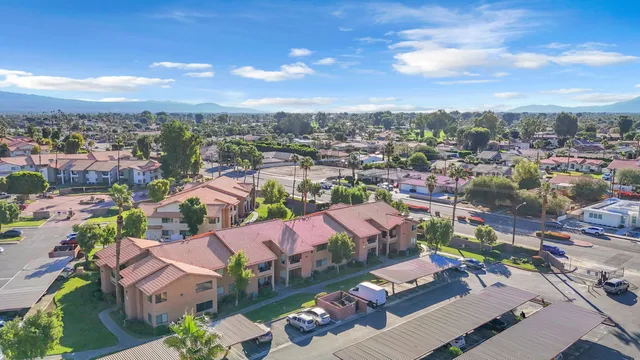 an aerial view of residential houses with outdoor space