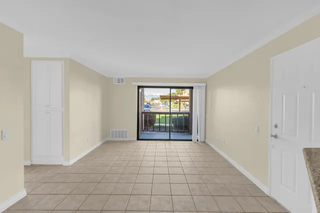 a kitchen with cabinets and stainless steel appliances