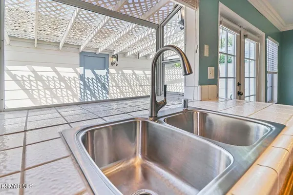 a view closeup a kitchen sink with wooden floor
