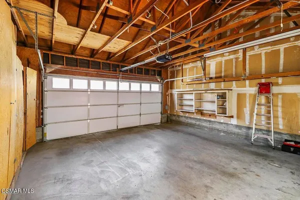 a view of a room with wooden walls