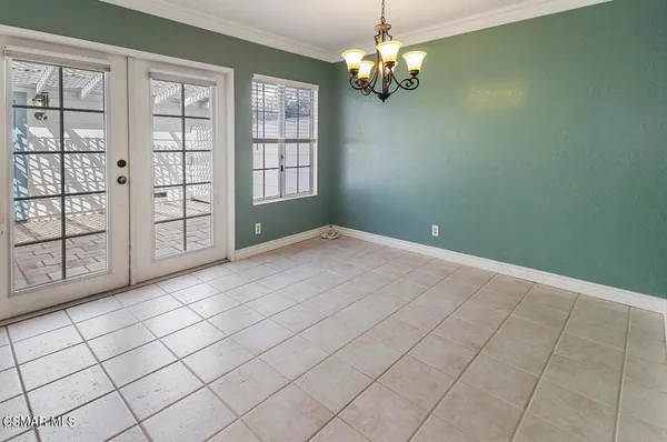 a view of empty room with windows