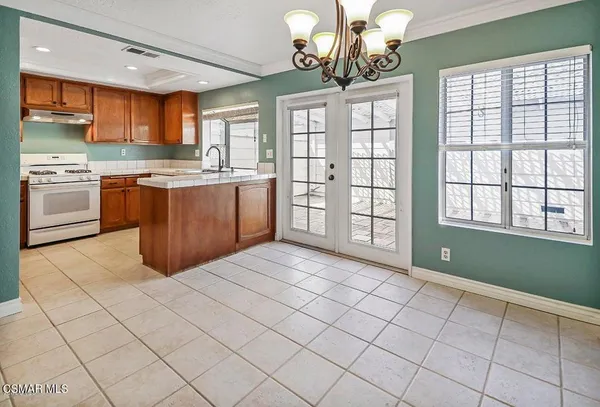 a kitchen with a sink cabinets and window