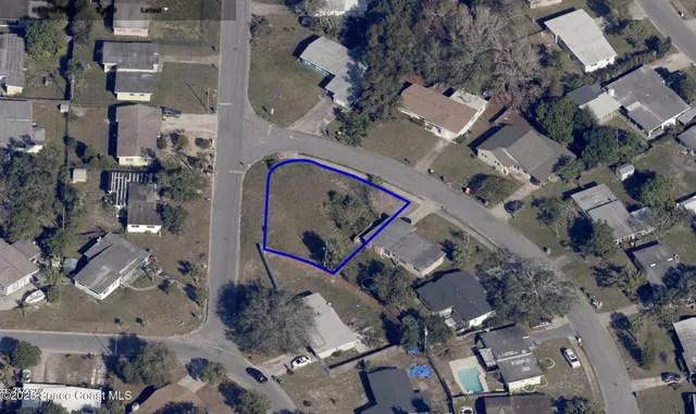 an aerial view of multiple houses with outdoor space
