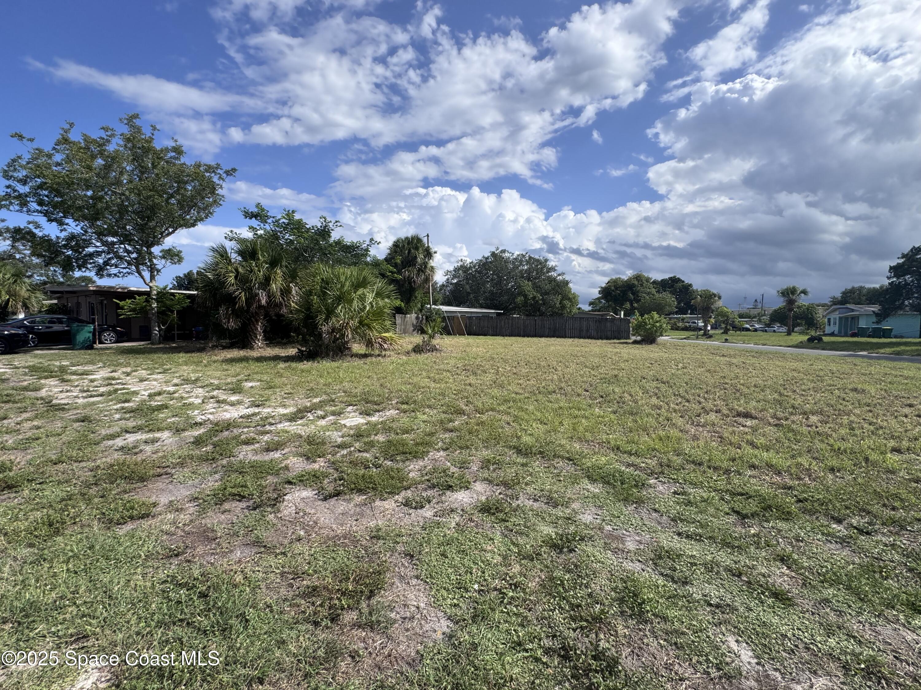 406 Prospect Avenue Cocoa, FL 32922 - Photo 4 of 6 a view of a field with an trees in the background