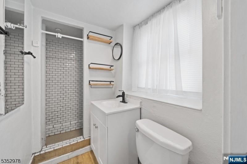 1283 Valley Road, Unit 7 Montclair, NJ 07043 - Photo 22 of 26 a bathroom with a sink a toilet and shower