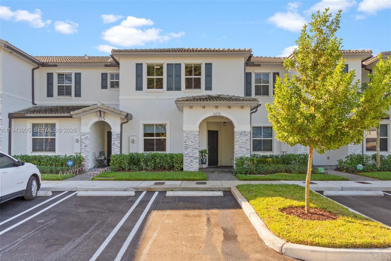 16276 Southwest 291st Street Homestead, FL 33033 - Photo 1 of 22 a front view of a house with garden