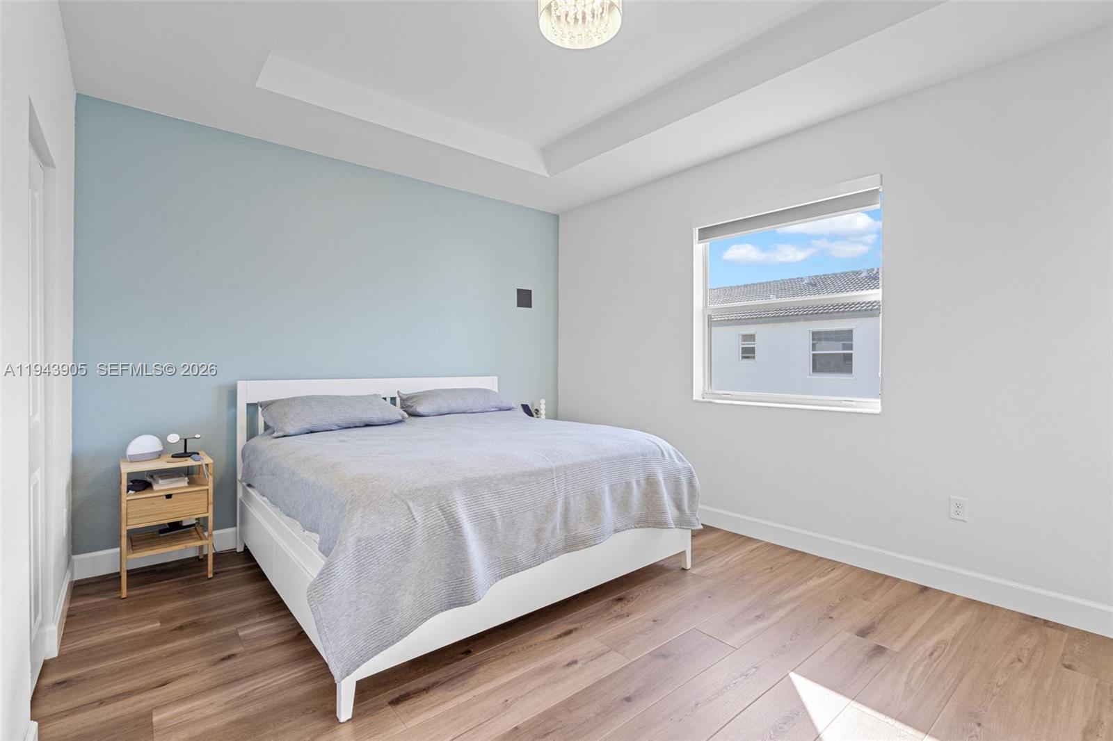 16276 Southwest 291st Street Homestead, FL 33033 - Photo 11 of 22 a bedroom with a bed and wooden floor